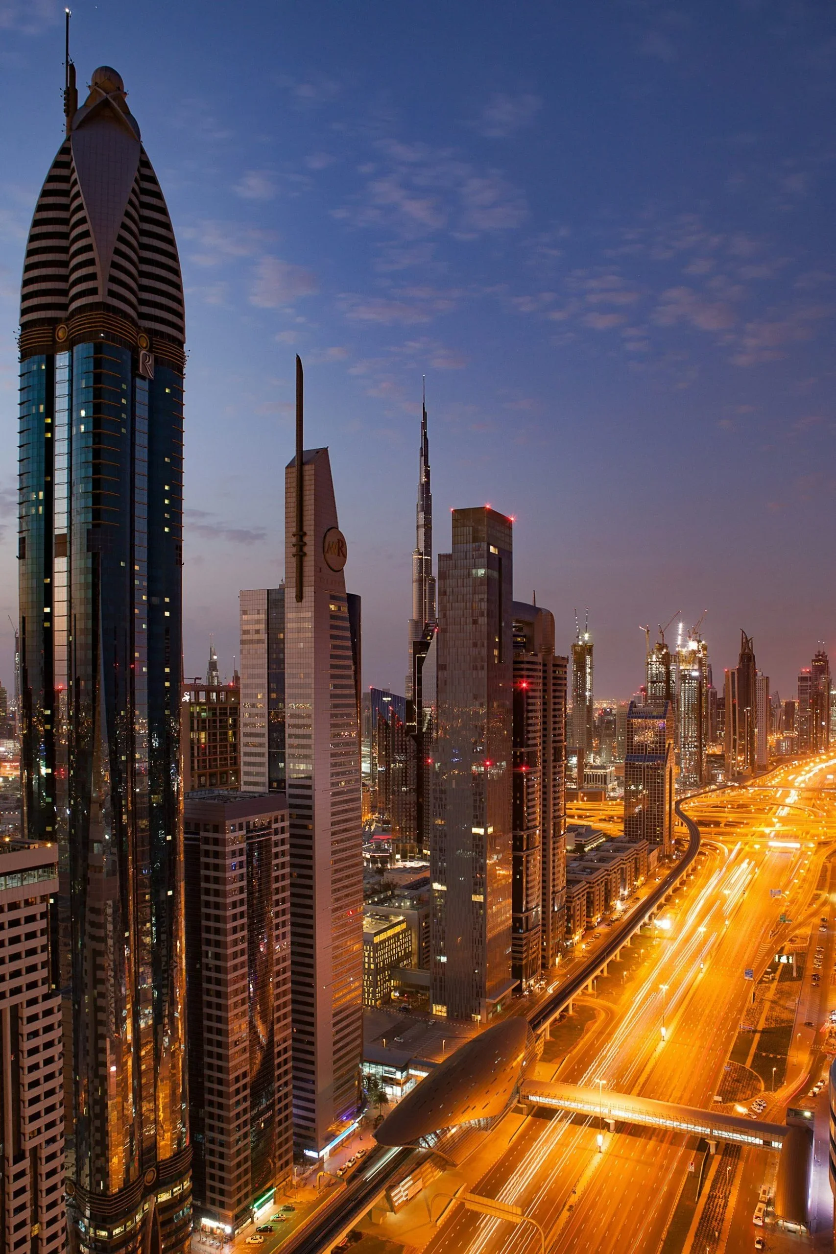 Dubai skyline along Sheikh Zayed Road at dusk
